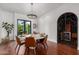 Bright dining room with hardwood floors and backyard view at 11827 S Montezuma Ct, Phoenix, AZ 85044