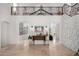 Bright foyer with wrought iron railing, stone accent wall, and tile floors leading to living spaces at 11827 S Montezuma Ct, Phoenix, AZ 85044