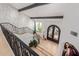 Grand foyer with arched double doors, detailed staircase, and stone accent wall at 11827 S Montezuma Ct, Phoenix, AZ 85044