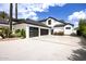 A spacious driveway leads to a modern three car garage, enhancing the home's curb appeal at 11827 S Montezuma Ct, Phoenix, AZ 85044