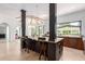Kitchen with island, dark wood accents, and view into dining room at 11827 S Montezuma Ct, Phoenix, AZ 85044