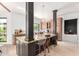 Kitchen island with dark wood and light granite featuring seating at 11827 S Montezuma Ct, Phoenix, AZ 85044