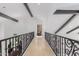 Open landing with decorative railing offering views of the foyer below at 11827 S Montezuma Ct, Phoenix, AZ 85044