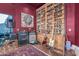 This stylish living room is host to an expansive shelving unit with a library ladder at 11827 S Montezuma Ct, Phoenix, AZ 85044