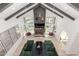 Spacious living room with beamed ceilings, fireplace, and views of the pool area at 11827 S Montezuma Ct, Phoenix, AZ 85044