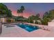 Luxurious swimming pool featuring multiple deck spaces with plush outdoor seating, mature landscaping, and a diving board at 11827 S Montezuma Ct, Phoenix, AZ 85044