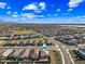 A birds eye view of a suburban neighborhood featuring homes with desert landscaping and a clear sky at 12472 W Kaler Dr, Glendale, AZ 85307
