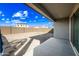 Expansive backyard with potential for customization, featuring a covered patio and privacy wall at 12472 W Kaler Dr, Glendale, AZ 85307