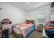 Cozy bedroom with soft lighting and comfortable decor, perfect for relaxing and unwinding after a long day at 12472 W Kaler Dr, Glendale, AZ 85307