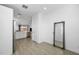 Open-concept kitchen area with stainless steel appliances and open view to the living area at 12472 W Kaler Dr, Glendale, AZ 85307