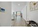 Spacious entry flows to the living area with tile floors and sliding glass doors leading to the backyard at 12472 W Kaler Dr, Glendale, AZ 85307