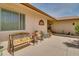 Cozy back patio area with comfortable seating, potted plants, and a tranquil outdoor setting at 12548 W Parkwood Dr, Sun City West, AZ 85375