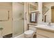 Bathroom featuring a shower, grab bars, toilet, vanity, mirror, and towel rack for convenience at 12548 W Parkwood Dr, Sun City West, AZ 85375
