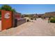 Landscaped entrance to the community recreation center with lush desert plants at 12548 W Parkwood Dr, Sun City West, AZ 85375
