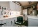 Functional garage space with built-in shelving, work bench, and laundry area at 12548 W Parkwood Dr, Sun City West, AZ 85375
