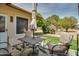 Cozy patio with cushioned chairs and a table, ideal for enjoying outdoor living at 12548 W Parkwood Dr, Sun City West, AZ 85375