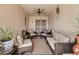 Inviting covered patio featuring comfortable seating, decorative accents, and an open and airy atmosphere at 12548 W Parkwood Dr, Sun City West, AZ 85375