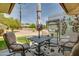 Inviting outdoor patio featuring comfortable seating and an umbrella-shaded table, perfect for relaxation at 12548 W Parkwood Dr, Sun City West, AZ 85375