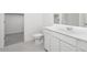 Neutral bathroom featuring a vanity, a toilet, and an open walk-in closet at 13198 E Verbina Ln, Florence, AZ 85132