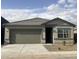 Well maintained single story home featuring a two-car garage and desert landscaping at 13198 E Verbina Ln, Florence, AZ 85132