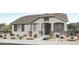 Charming single-story home featuring a neutral color palette, desert landscaping, and a welcoming front entrance at 14592 W Sand Hills Rd, Surprise, AZ 85387