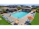 Community pool with ample seating for residents to relax and enjoy the sun at 14639 W Sand Hills Rd, Surprise, AZ 85388
