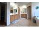 View of bathroom with double vanities, walk-in closet and a corner tub at 15515 N 174Th Ave, Surprise, AZ 85388