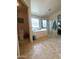 Relaxing bathroom with a large tub, a window, a separate shower, and tile floors at 15515 N 174Th Ave, Surprise, AZ 85388