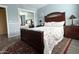 Bedroom showcasing hardwood floors, mirrored closet doors, and a large bed with decorative pillows at 15515 N 174Th Ave, Surprise, AZ 85388