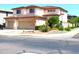 Inviting two-story home with desert landscaping, spacious garage, and manicured lawn on a corner lot at 15515 N 174Th Ave, Surprise, AZ 85388