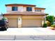 Charming two-story home featuring an attached two-car garage and well-maintained landscaping at 15515 N 174Th Ave, Surprise, AZ 85388