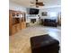 Spacious living room with fireplace, flat screen tv and tile flooring at 15515 N 174Th Ave, Surprise, AZ 85388