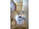 Carpeted staircase with wood railing, leading to a lower level with decor in niche at 15515 N 174Th Ave, Surprise, AZ 85388