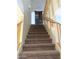 Carpeted stairs leading to upper level, featuring wood railings at 15515 N 174Th Ave, Surprise, AZ 85388