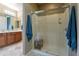 Well-appointed bathroom featuring a walk-in shower with glass door, cherry cabinets and tile flooring at 16336 E Ridgeline Dr, Fountain Hills, AZ 85268
