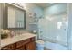 Bathroom with tile floors, single sink vanity and shower over tub with sliding glass door at 16336 E Ridgeline Dr, Fountain Hills, AZ 85268