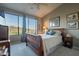 Comfortable bedroom with neutral paint, ceiling fan, carpet, and scenic window at 16336 E Ridgeline Dr, Fountain Hills, AZ 85268