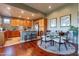Bright dining area with a glass table, upholstered chairs, and adjacent to the kitchen at 16336 E Ridgeline Dr, Fountain Hills, AZ 85268