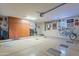 Well lit garage space with epoxy floors, mounted bicycle, and ample storage cabinets at 16336 E Ridgeline Dr, Fountain Hills, AZ 85268
