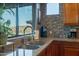 Granite countertops and stainless steel sink in a modern kitchen with great outdoor views from the window at 16336 E Ridgeline Dr, Fountain Hills, AZ 85268
