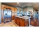 Bright and airy kitchen with stainless steel appliances and a central island, adjacent to the dining area at 16336 E Ridgeline Dr, Fountain Hills, AZ 85268