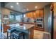 Modern kitchen with granite countertops, stainless steel appliances, and a breakfast bar with seating at 16336 E Ridgeline Dr, Fountain Hills, AZ 85268