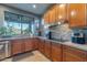 Spacious kitchen with granite countertops, stainless steel appliances, and a scenic view from the window at 16336 E Ridgeline Dr, Fountain Hills, AZ 85268