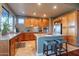 Well-lit kitchen featuring a large island with bar seating, granite countertops, and stainless steel appliances at 16336 E Ridgeline Dr, Fountain Hills, AZ 85268