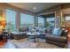 Well-lit living room featuring hardwood floors, a sectional sofa, and expansive views at 16336 E Ridgeline Dr, Fountain Hills, AZ 85268