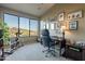 Inviting office space with a large window showcasing beautiful outdoor views and neutral colored walls at 16336 E Ridgeline Dr, Fountain Hills, AZ 85268
