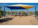 Outdoor area with a shade canopy, featuring small tables and benches, with a view of the lake in Fountain Hills, Arizona at 16336 E Ridgeline Dr, Fountain Hills, AZ 85268