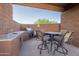 Outdoor kitchen and dining area with built-in grill, perfect for entertaining guests and enjoying outdoor meals at 16336 E Ridgeline Dr, Fountain Hills, AZ 85268