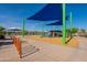 A colorful playground with sunshades features a view of Fountain Lake in Fountain Hills, Arizona at 16336 E Ridgeline Dr, Fountain Hills, AZ 85268