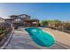 Inviting pool area featuring a covered lounge with patio seating and views of the surrounding landscape at 16336 E Ridgeline Dr, Fountain Hills, AZ 85268